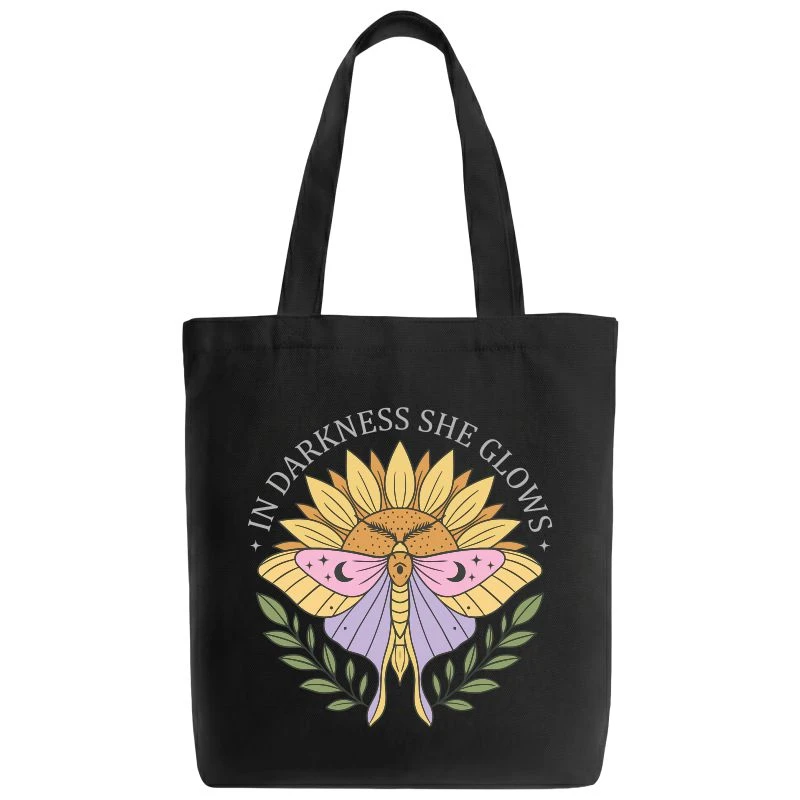 In Darkness She Glows Tote Bag